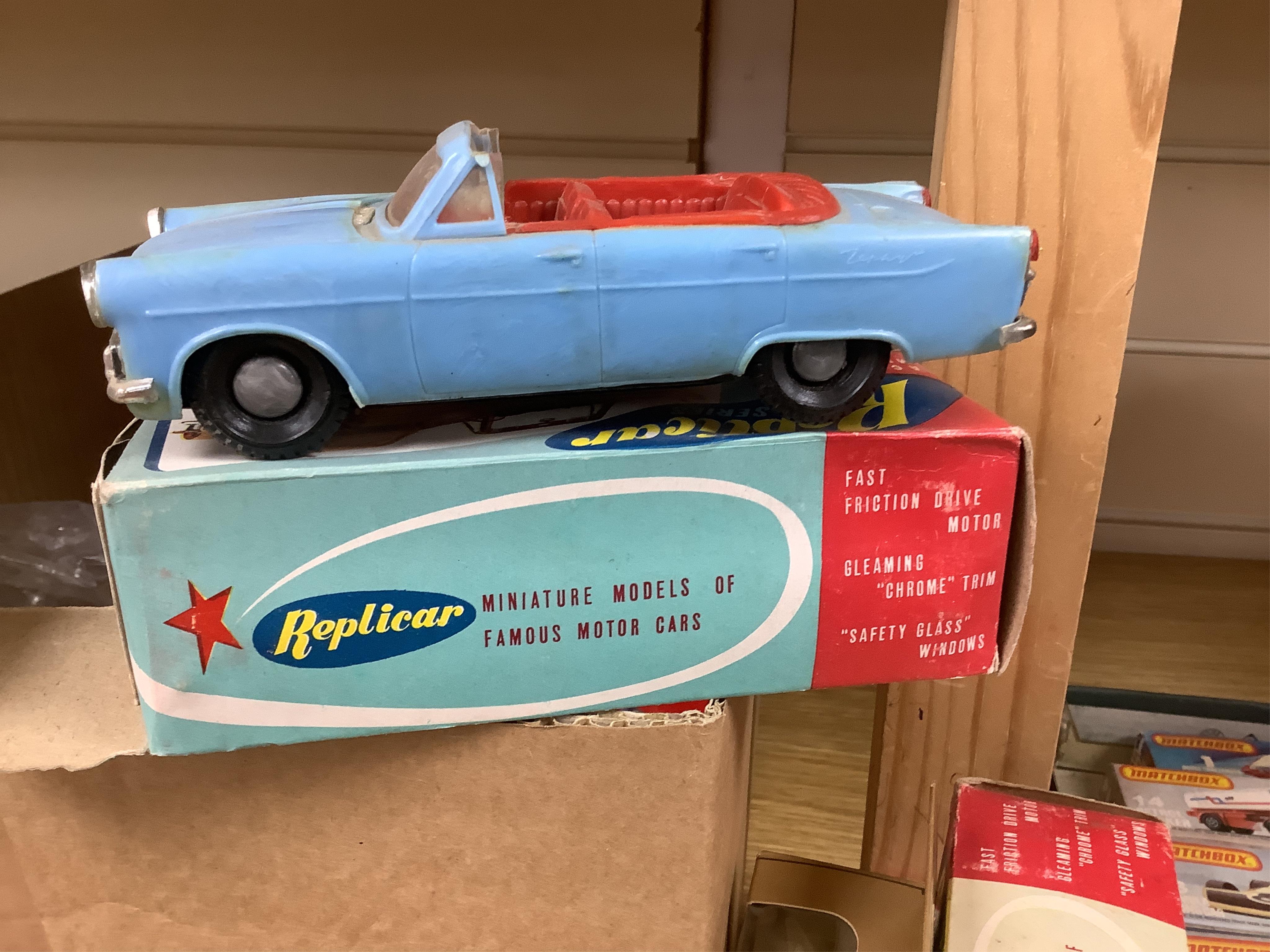 A quantity of diecast vehicles and a few useful boxes including; a boxed Clifford Series Ford Zephyr convertible, two boxed Replicar series Ford Zephyr convertibles, ten unboxed Dinky Toys, two Scalextric Formula One car